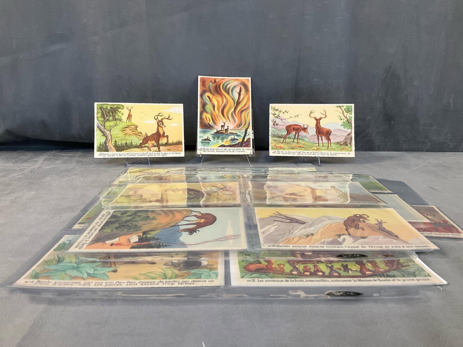 Bambi Postcards: Circa 1940 set of twenty five ( numbers 1-25) Superluxe Editions Walt Disney - Mickey -Mouse, S.A. Bambi postcards printed in French in France. Good unused condition. Each card measures 5.5 inches wid
