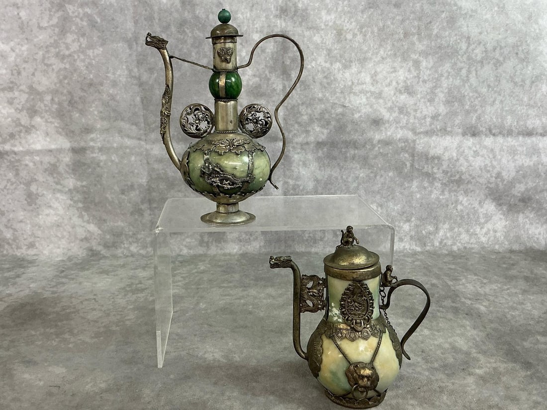 Decorative Asian Style Miniature Teapots: Two antique miniature Asian style teapots or flagons. Silver toned metal with green inlaid stone. Flagons are intricately decorated with metal dragons, birds, lions and monkeys with stone bodies. Some