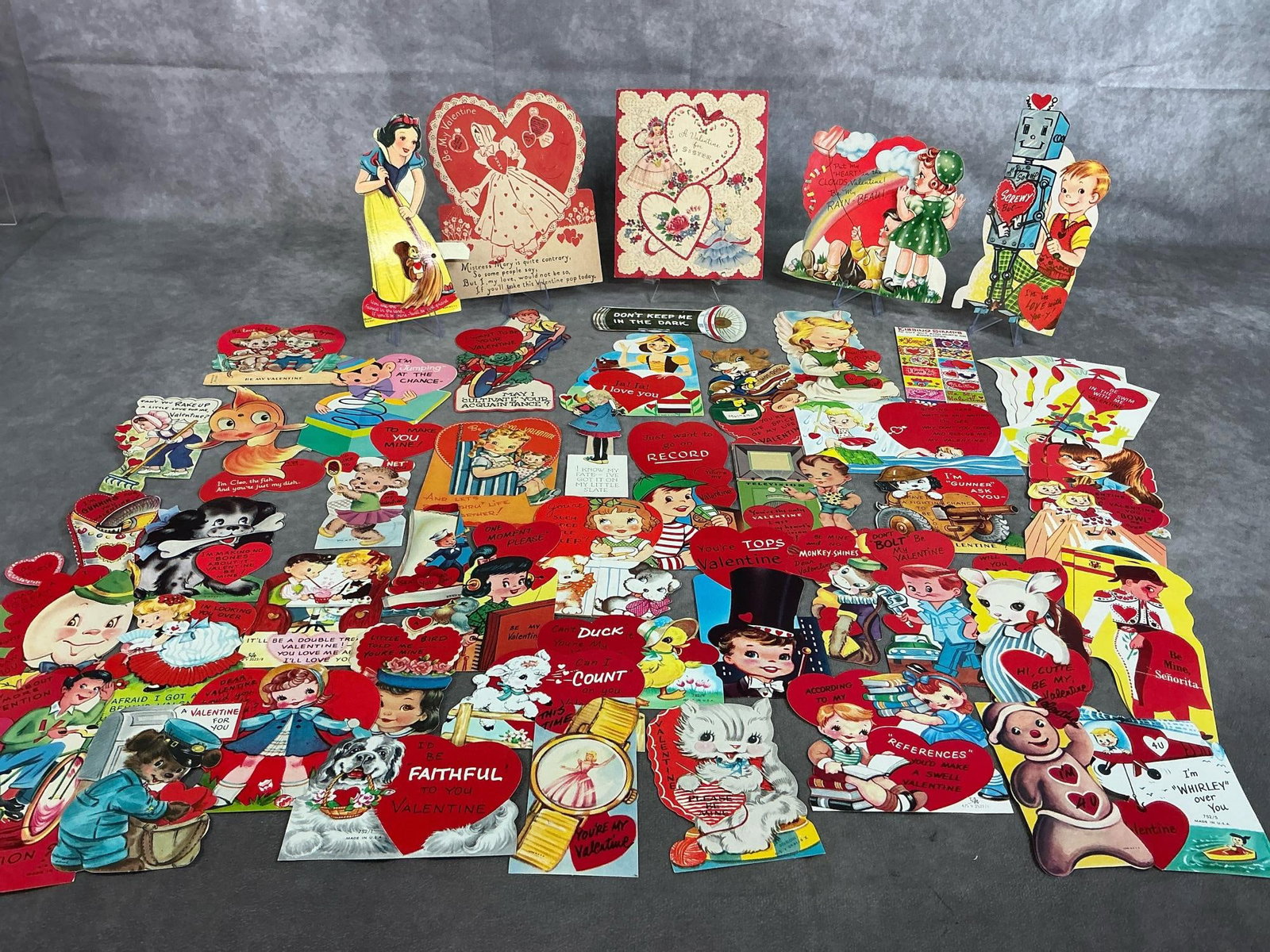 Vintage Valentines: Fifty 1930's -1960's children's valentines. Most have writing on back, but in good condition. Largest measures 5 inches wide x 6 inches tall.