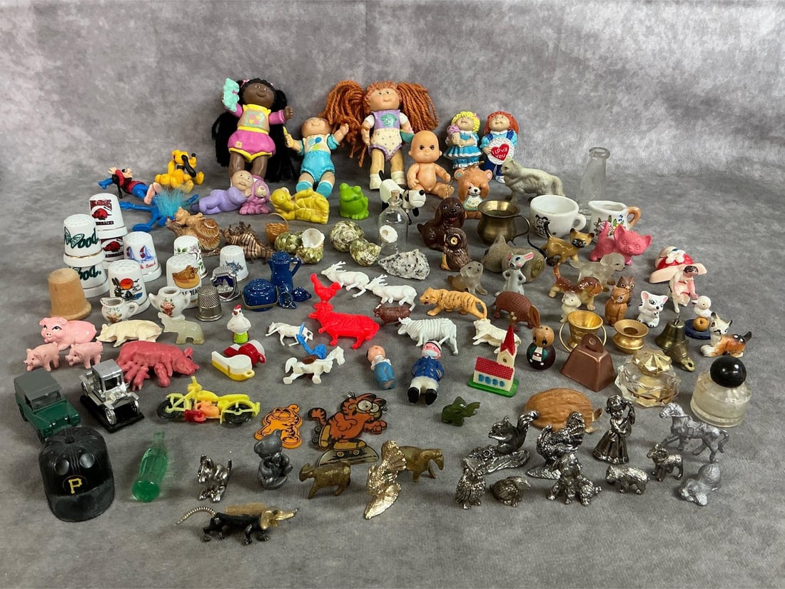 Miniature Collectibles: More than one hundred miniature collectibles from mid to late 1900's. Includes miniature dolls, plastic and ceramic animals, pewter items, thimbles, shells, and more. Some items show wear from age.