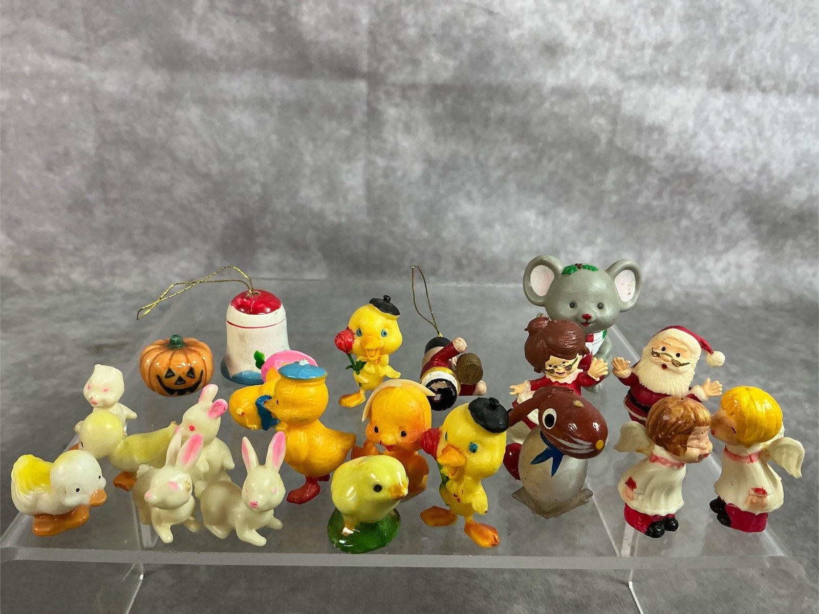 Vintage Miniatures: Twenty-one mid 1900's plastic and ceramic miniature. Include Easter chicks and ducks, angels, Santa and Mrs. Clause, and more. Some color fading, otherwise in good condition. Grey mouse measures 1