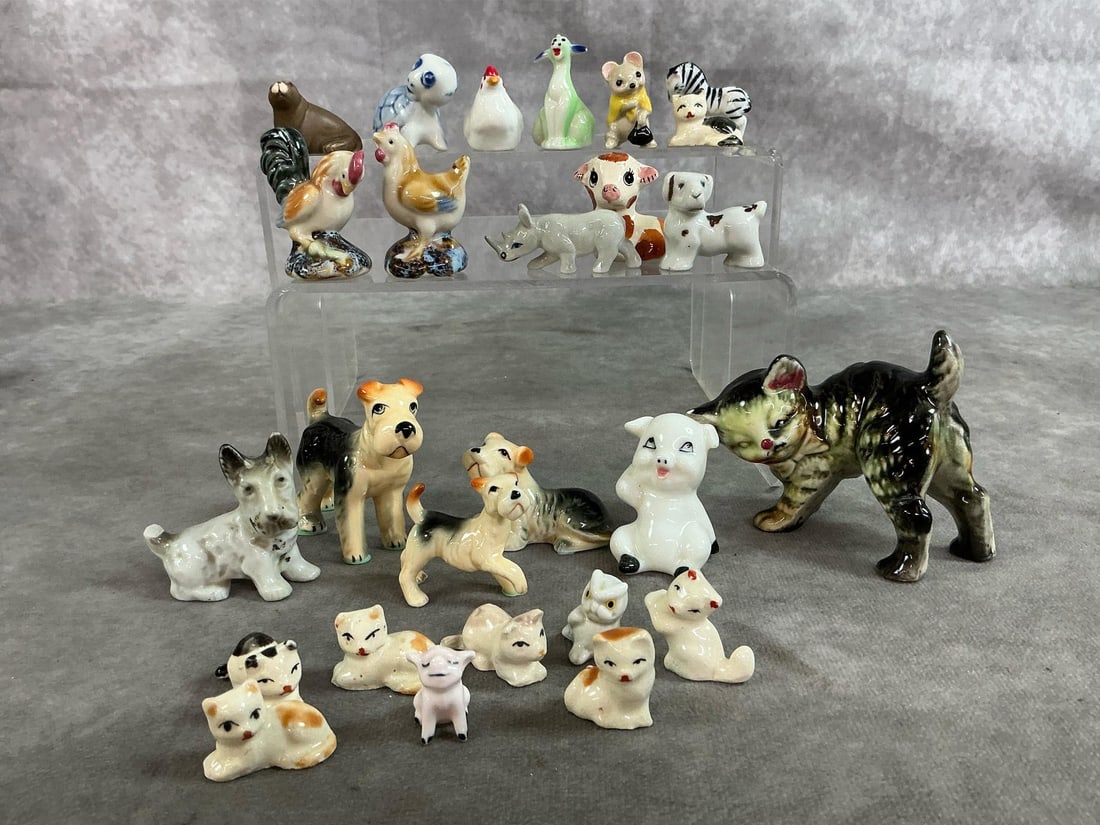 Miniature Animals: Twenty five mid to late 1900's miniature collection. Includes ceramic cats, dogs, chickens, pigs, and more. A few have small breaks. Largest cat measures 3.25 inches long x 1.5 x 2.5 inches tall.
