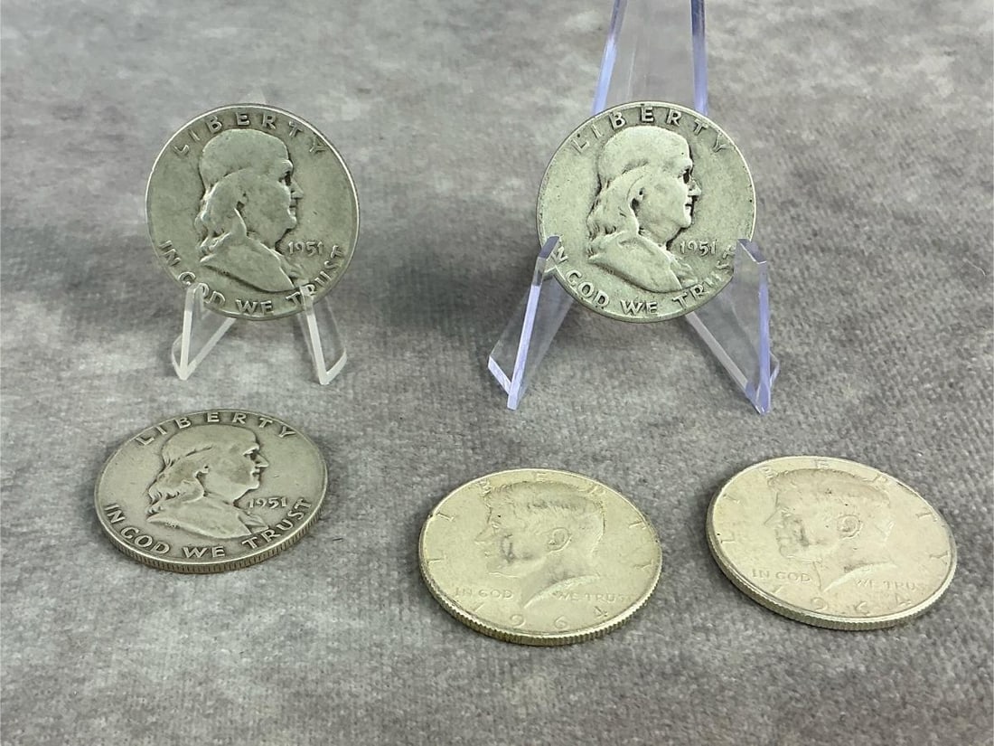 United States Halves: Three 1951 Franklin Half Dollars and two 1964 Kennedy Half Dollars. All in good circulated condition. Total weight 1.97 ozt.