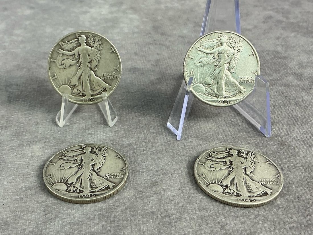 Walking Liberties: Four 1944 and 1945 Walking Liberty Half Dollars. All in good circulated condition. Total weight 1.58 ozt.
