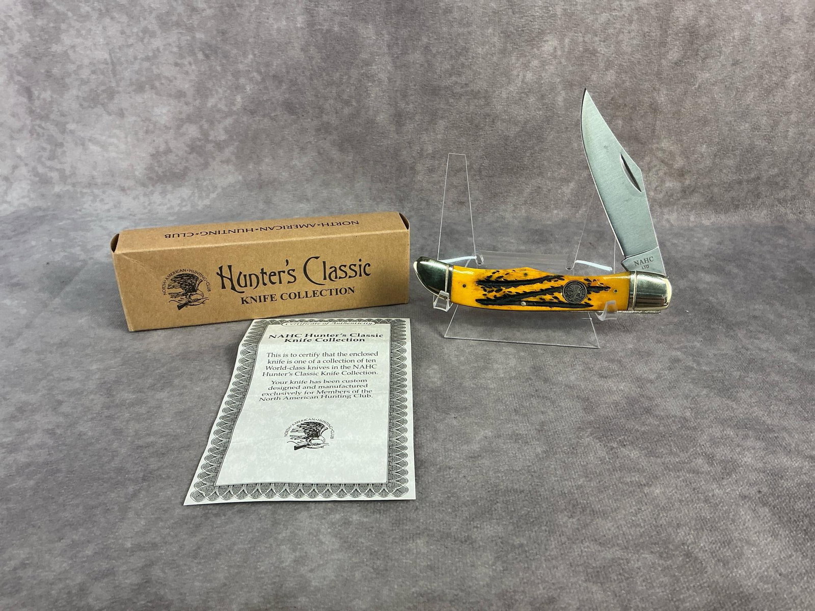 Hunters Classic Knife: North American Hunting Club hunters classic knife. Tight snap, comes with original box. Box measures 6 inches wide x 1.75 inches tall.
