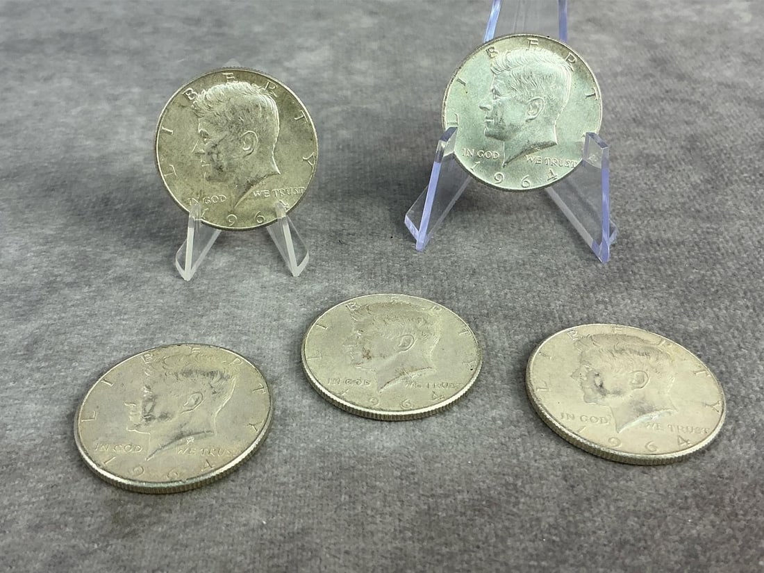 Kennedy Halves: Five 1964 Kennedy Half Dollars. All in fair to good circulated condition. Total weight 2.01 ozt.