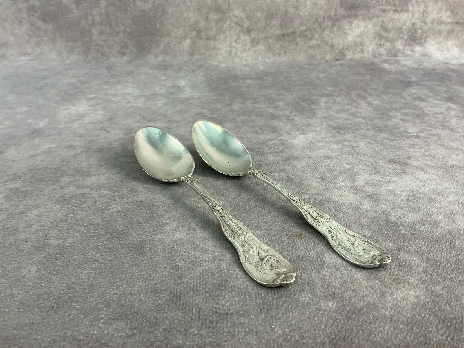 Gorham Sterling Spoons: Two circa 1900 mythologique spoons by Gorham Sterling. In good condition, stamped with oxidation present. Total weight 2.29 ozt.