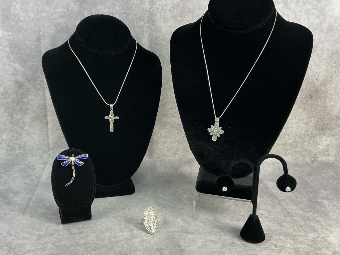 Sterling Silver Jewelry: Sterling silver jewelry including two necklaces with pendants, one pair of earrings, one brooch and one ring. All in good condition, stamped with oxidation present. Total weight 0.86 ozt.