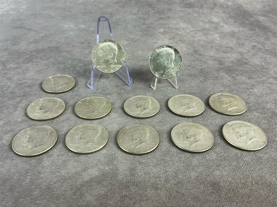 Kennedy Halves: Twelve 1967 and one 1965 Kennedy Half Dollars. All in fair to good circulated condition. Containing 40 percent silver with a total weight of 4.8 ozt.