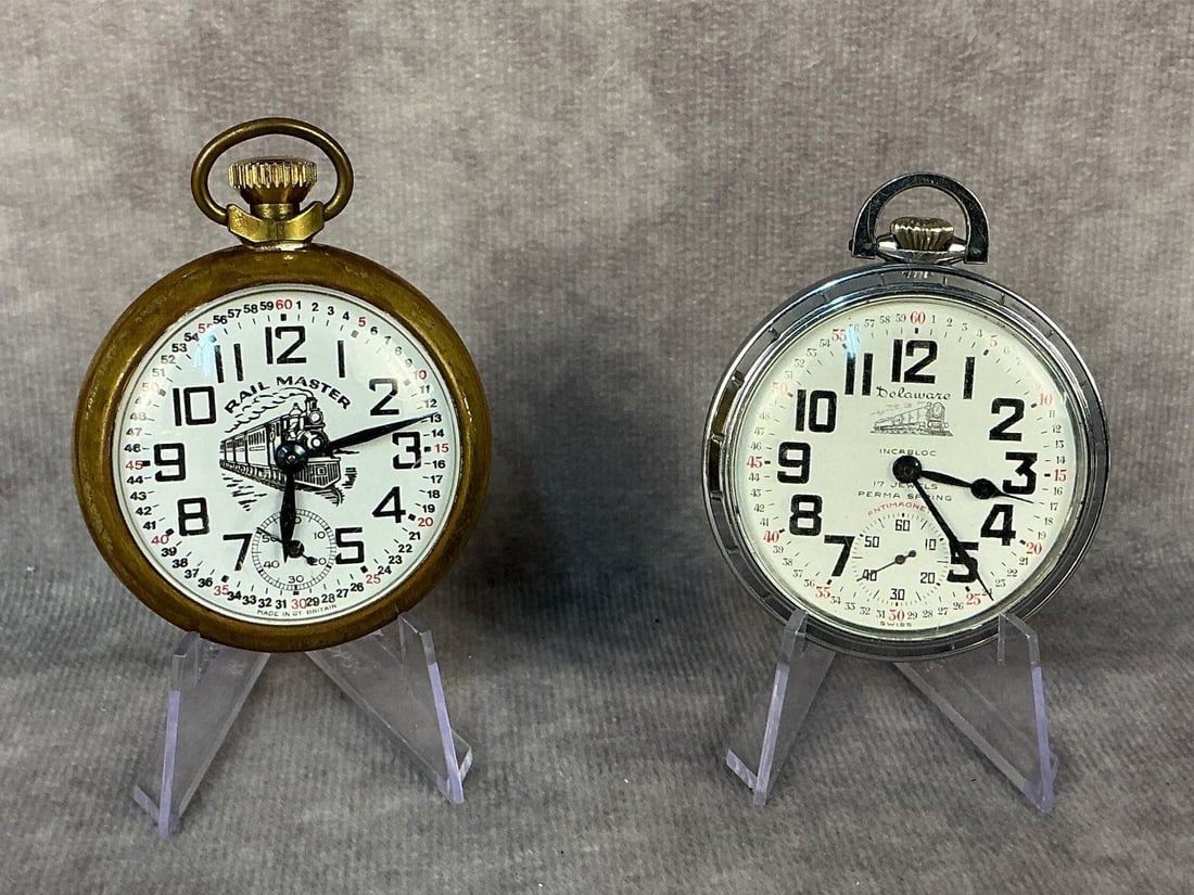 Railroad Pocket Watches: Two vintage railroad theme pocket watches. Delaware Watch Co, 17 jewel, Swiss made pocket watch. Rail Master, made in Great Britain. Both currently running.