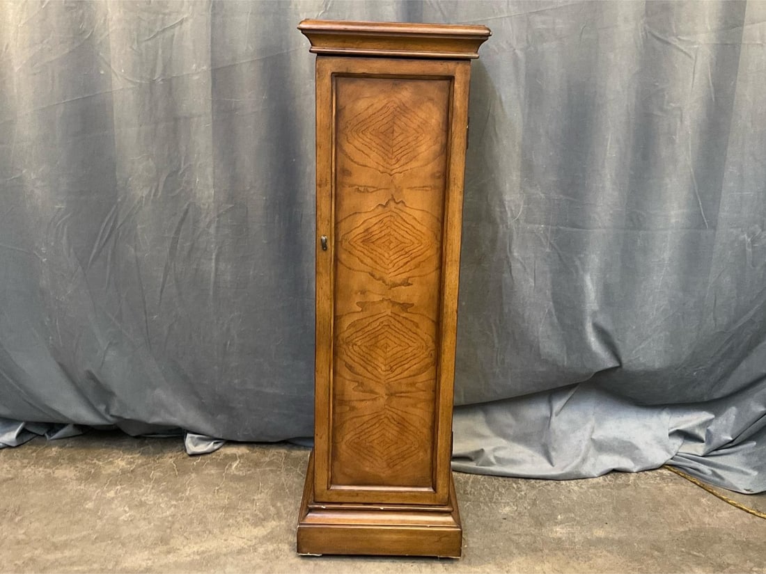 Cabinet/Pedestal: Contemporary pedestal/cabinet with shelf. Good condition with some scratches to finish. Measures 14 inches wide x 14 x 44 inches tall.