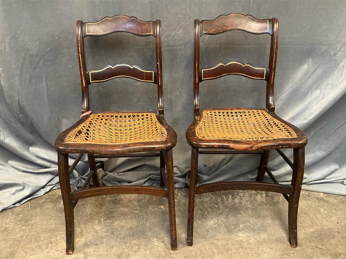 Victorian Chairs: Pair of mid-19th century faux painted side chairs with cane seats. Screw repairs to stiles and damaged seats. Measures 17.5 inches wide x 15 x 33 inches tall.