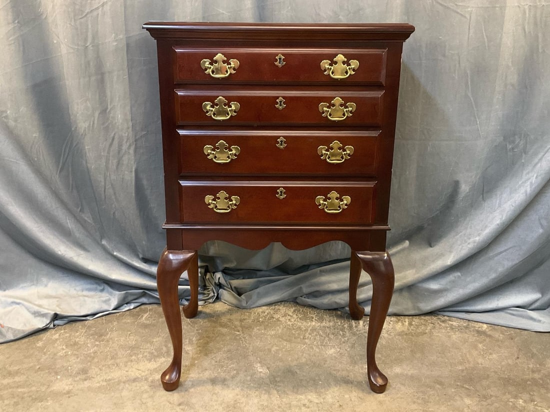 Silver Chest: Contemporary Drew American reproduction Queen Anne Style silver four drawer chest with cabriole legs and brass batwing pulls. Good condition. Measures 26 inches wide x 17 x 41.5 inches tall.