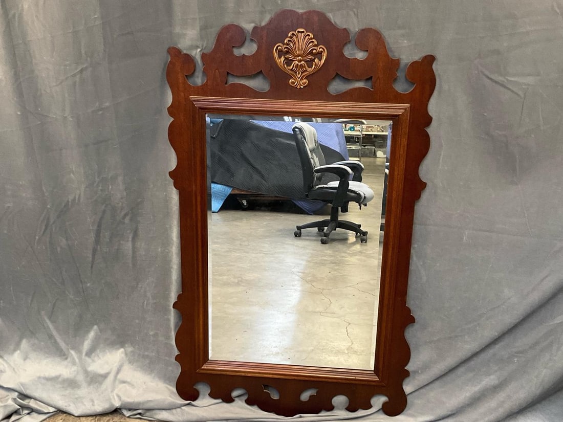 Chippendale Mirror: Late 20th century Chippendale style fretwork mirror with gilded shell cartouche. Good condition. Measures 30 inches wide x 1 x 50.5 inches tall.