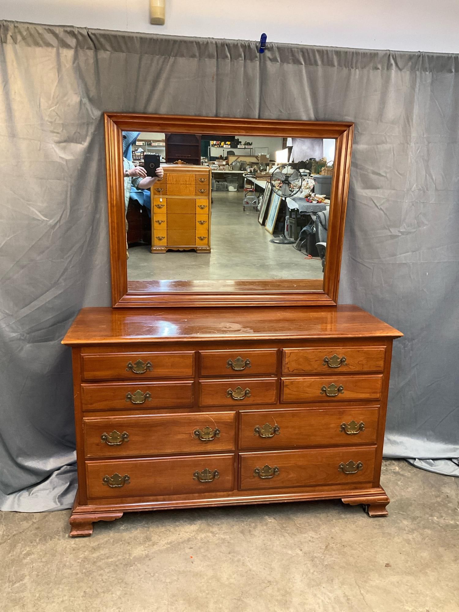 Dresser: Mid-20th century Kling Furniture Company cherry dresser/chest of ten drawers with mirror. One brass drawer pull missing screw, scratches, some expected wear to finish on top. Otherwise good condition.