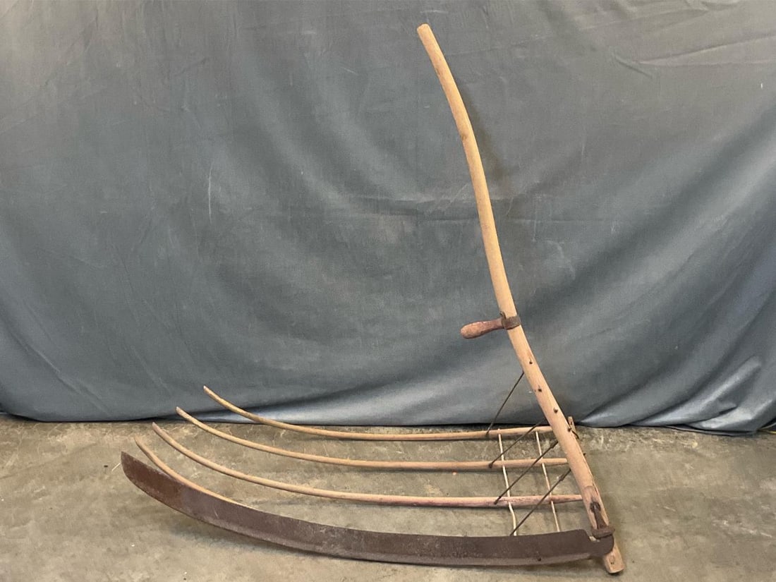 Cradle Scythe: Late 19th century cradle scythe. Surface rust, otherwise good condition. Measures 47 inches wide x 30 x 49 inches tall.