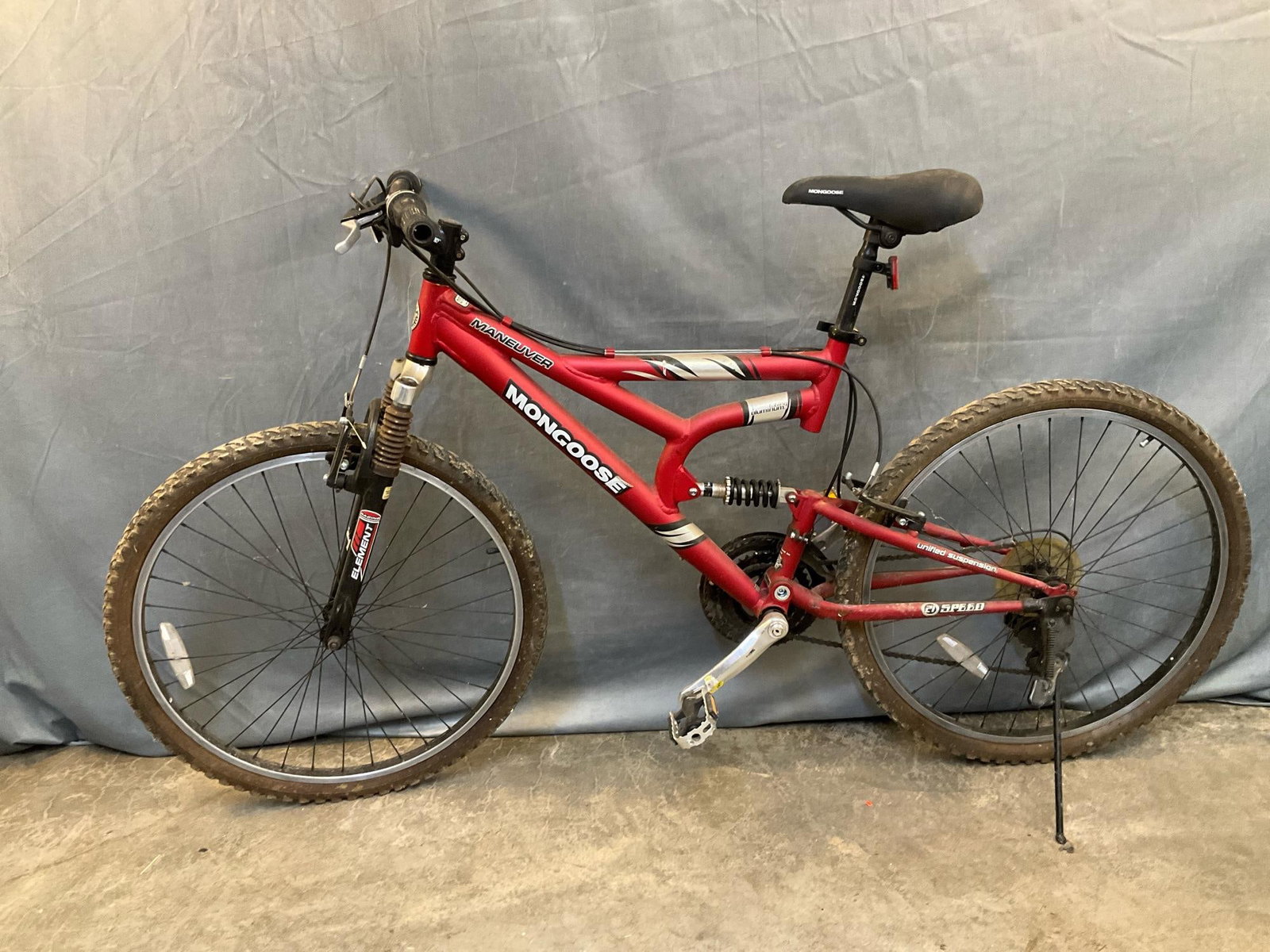 Mongoose Bike: Contemporary Maneuver Mongoose Mountain Bike with unified suspension, twenty one speed and aluminum tubing. Used condition, not tested. Measures 68 inches wide x 14 x 37 inches tall to handlebars.