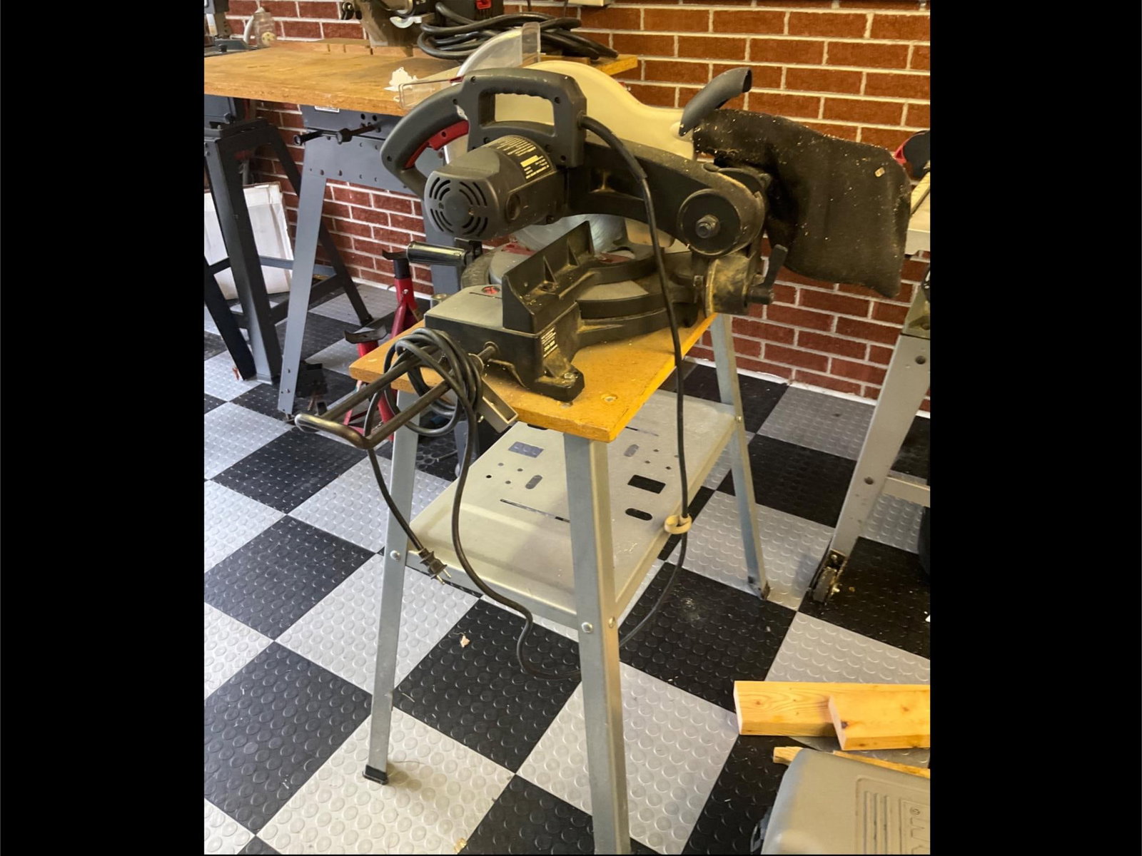 Pro-Tech Miter Saw: 10 inch on stand. Used in good condition. Measures 40 inches long X 26 inches wide X 47 inches high.