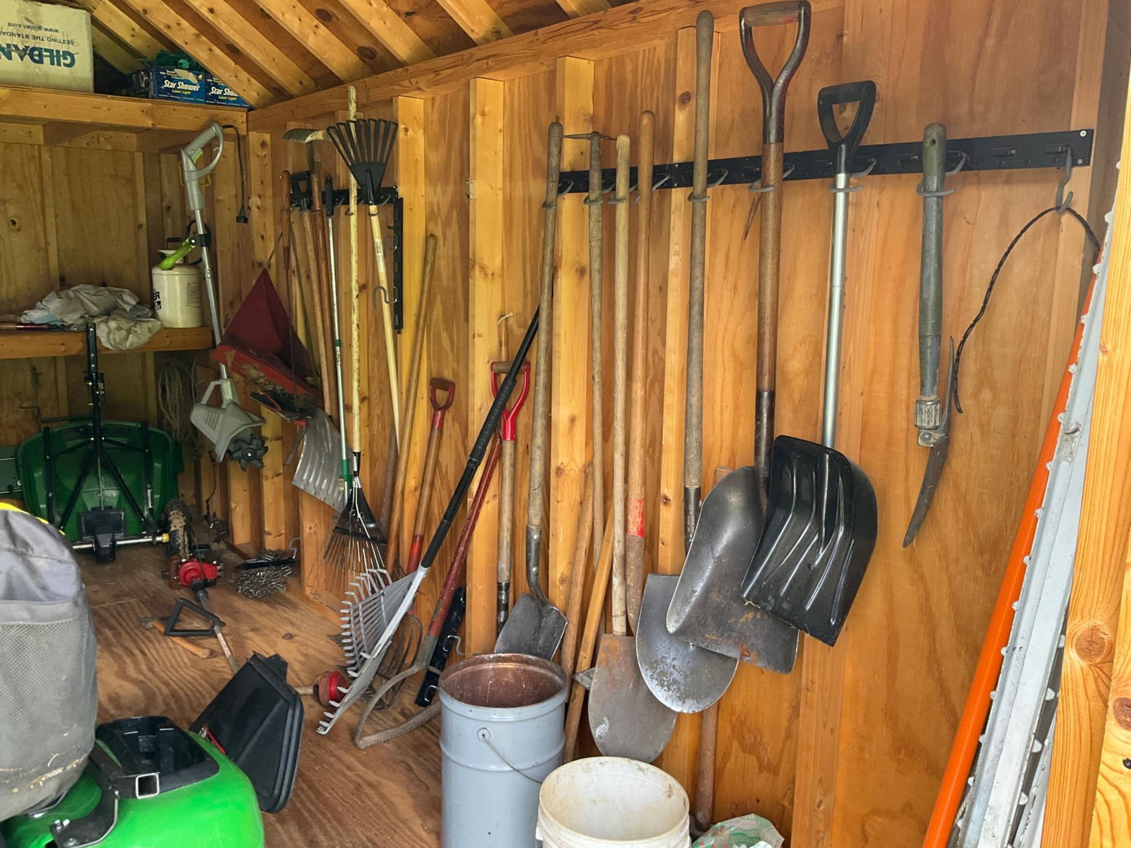 Assorted Shed Tools: Assorted tools located in shed including; Craftsman Chainsaw, Echo PB 251 leaf blower, Echo HC 150 trimmer saw, Earthwise TC70025 2.5 amp tiller/cultivator, shovels, rakes and more. Used good
