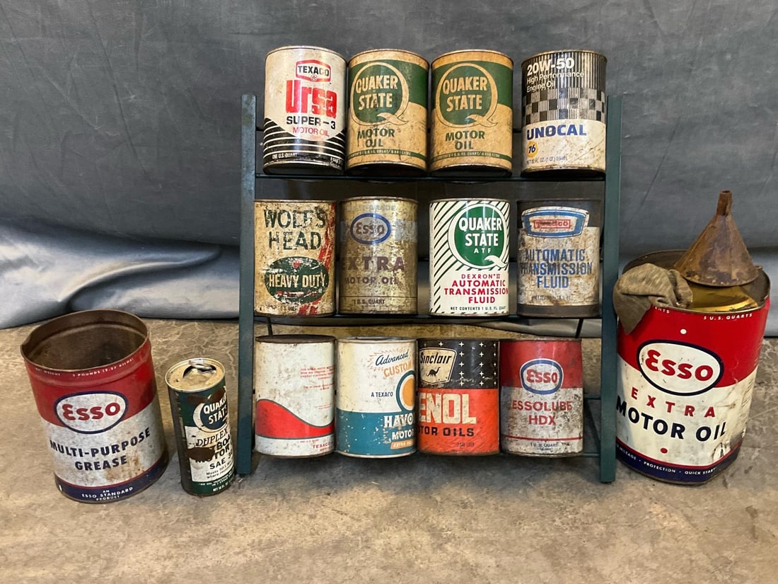 Motor Oil Cans: Fifteen vintage collectible motor oil cans with metal display rack. Includes; Texaco, Quaker State, Esso, Sinclair, Unocol 76, and more. Plus two large Esso cans and one 16 ounce Quaker State can.