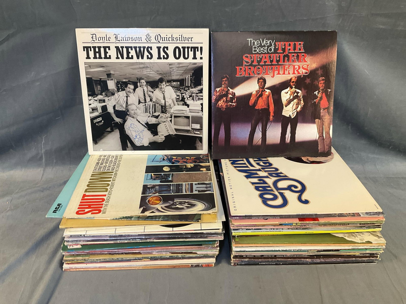 Vintage LP's: Approximately fifty five mostly 1970's assorted genre LP record albums. Featuring Doyle Lawson and Quicksilver's "The News Is Out!" autographed album cover and record. Includes; Christmas music,