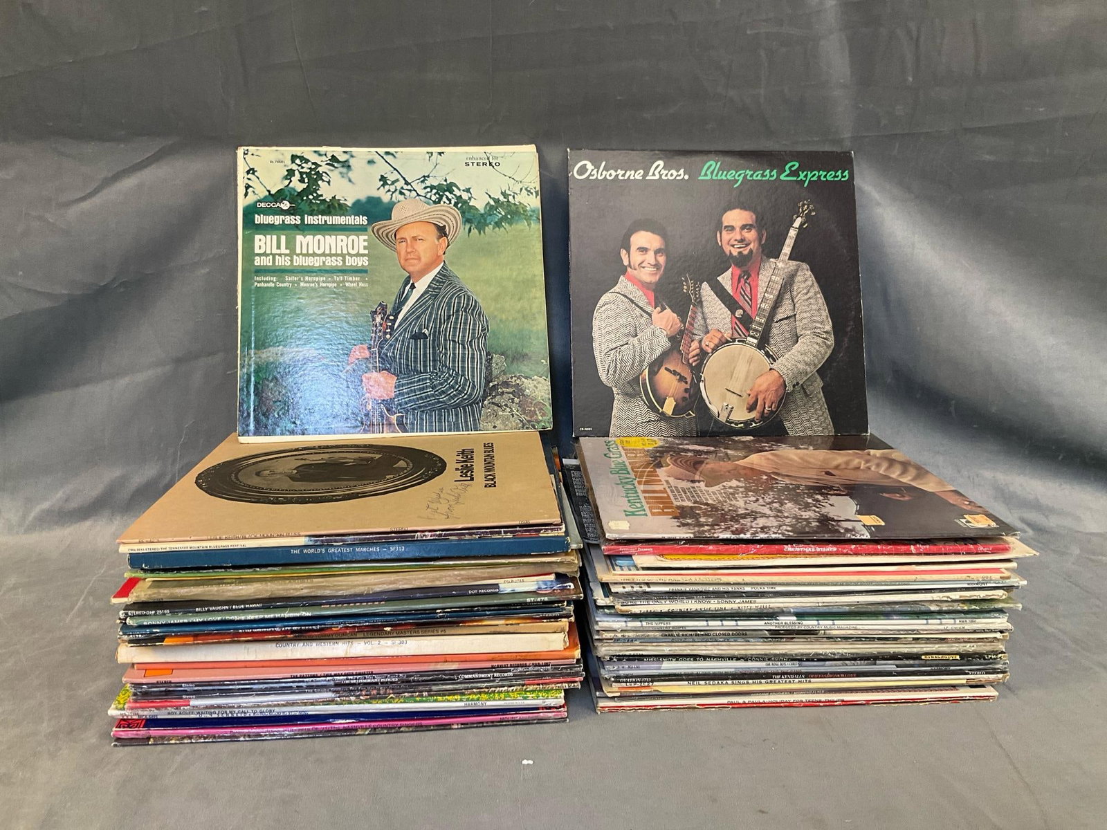 Vintage LP's: Approximately 60 mostly 1970's assorted genre LP record albums consisting of mostly Bluegrass and Classic Country. Including; Bill Monroe, Osborne Brothers, Andrews Sisters, Christmas music, Frankie