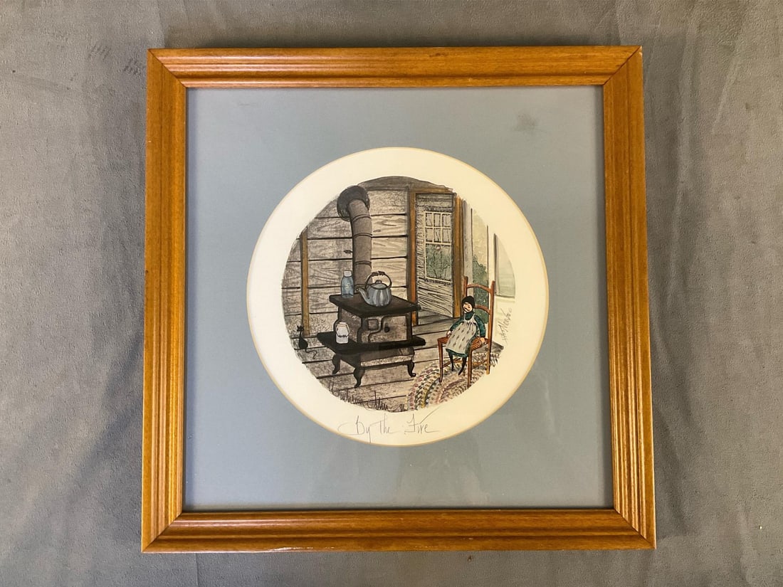 P.B. Moss Print: 1996 "By The Fire" framed P. Buckley Moss signed print. Numbered 14/1000 prints. Professionally framed and matted. Good condition. Measures 14.75 inches wide x 1x 15 inches tall.