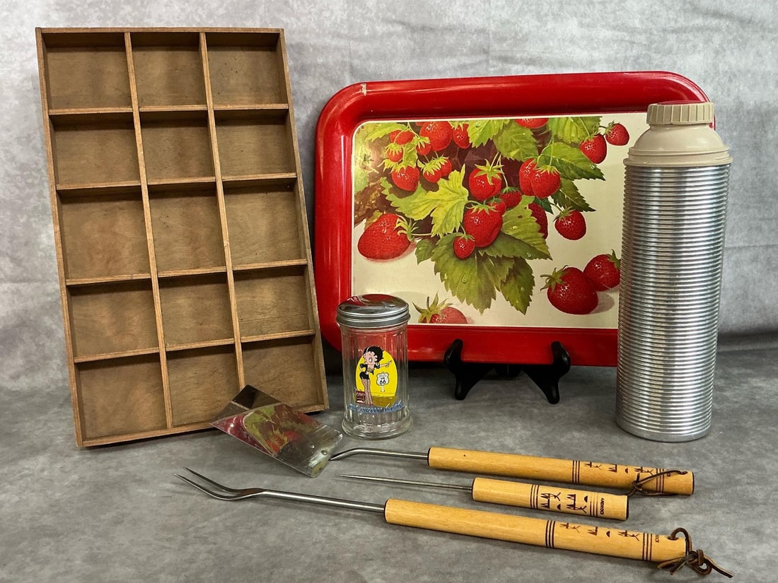 Vintage Kitchen Finds: Seven mid to late 1900's collectibles. Strawberry metal tray, trinket shelf (shadow box), and metal Thermos. Includes Androck BBQ tools with wooden handles and Betty Boop sugar dispenser. Slight paint
