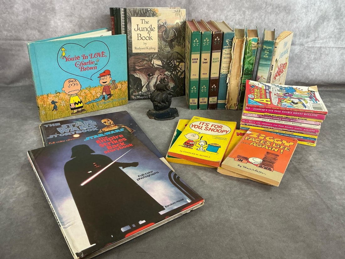 Vintage Children's Books: Twenty-six 1940's to 1980's hardcover and paperback books. Includes Star Wars 1980's, Archie and Jughead Comics from 1980's, classics from 1940's, Snoopy and more. Cast metal ship bookend included.