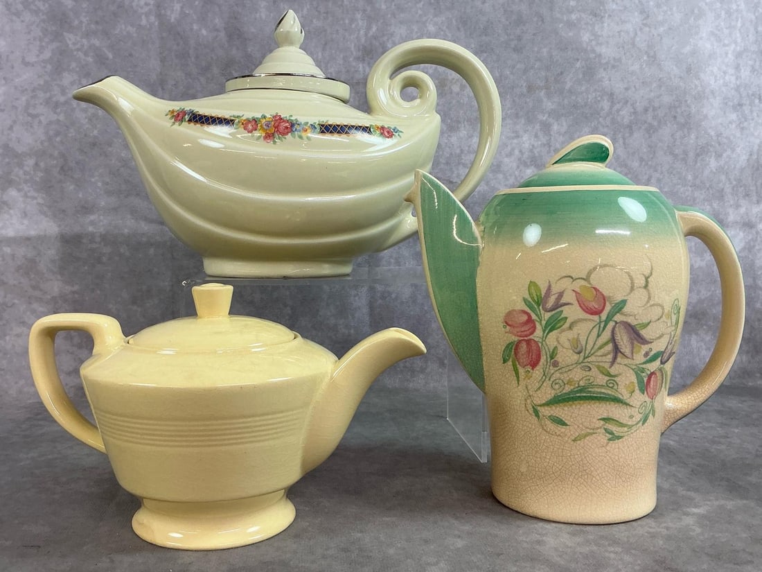 Vintage Coffee Pot & Tea Pots: Three early to mid 1900's teapots. Hall's "Aladdin " teapot with Blue Bouquet pattern, and yellow Jasmine of England teapot. Includes Susie Cooper coffee pot with Dresden Spray pattern in green and