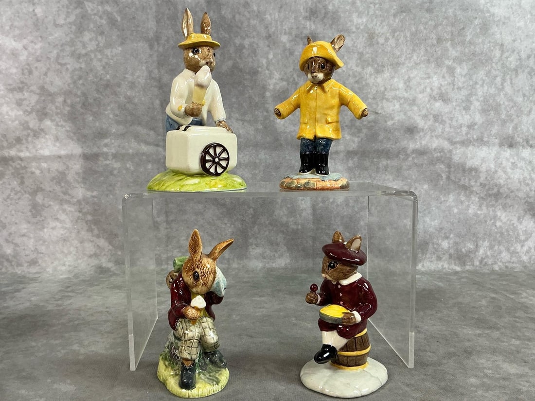 Royal Doulton Bunnykins: Four 1970's-2000 Bunnykin figures. Includes "Ice Cream", "Rainy Days", "Little Jack Horner", and "Cooling Off". In good condition. "Ice Cream" measures 2.25 inches at base x 2.5 x 4.5 inches tall.