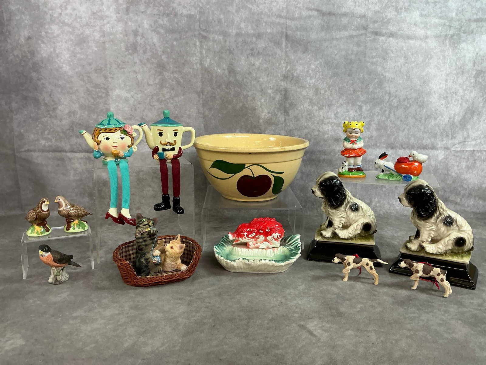 Watt Bowl & Figurines: Fourteen vintage items including a Watt number 8 apple pattern mixing bowl, two 1950's springer spaniel ceramic figurines, Arkansas Razorback ceramic dish & more. Dog ornament has a broken tail, other