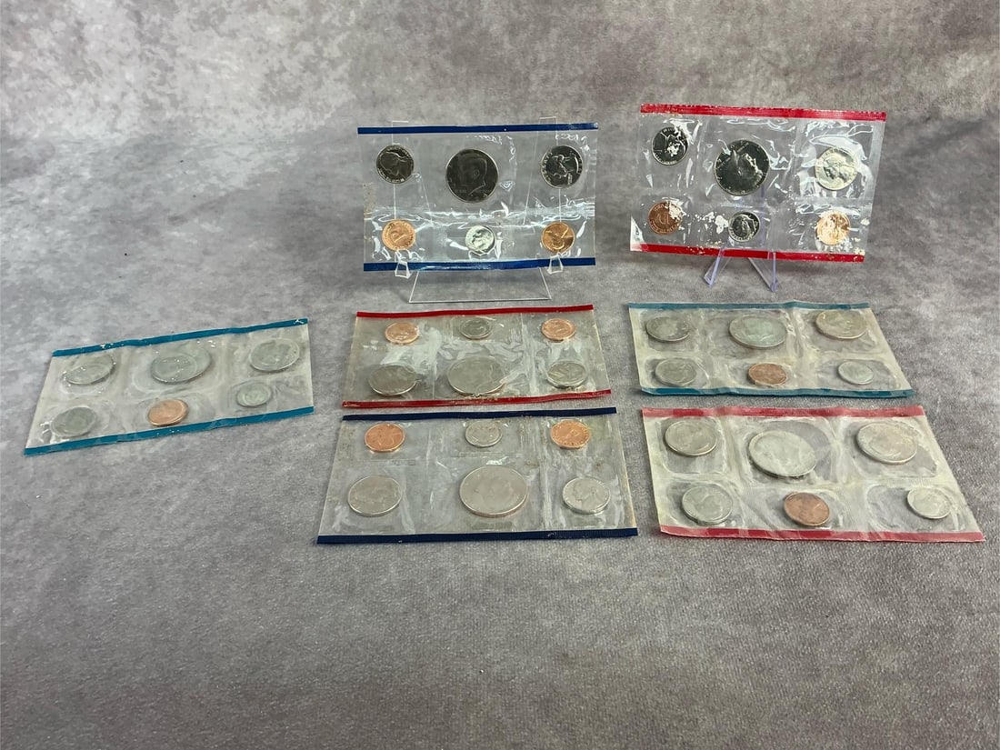 Proof Sets: Seven United States proof sets dated 1979 through 1986. All in good condition with sealed sleeves. Each measures 5.25 inches wide x 3 inches tall.