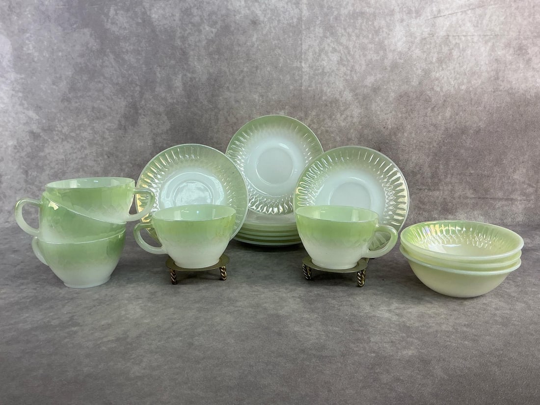 Federal Glass: Federal glass set including five cups, eight saucers, and three dessert bowls patterned in moonglow. All in good condition. Saucers measure 5.75 inches in diameter.
