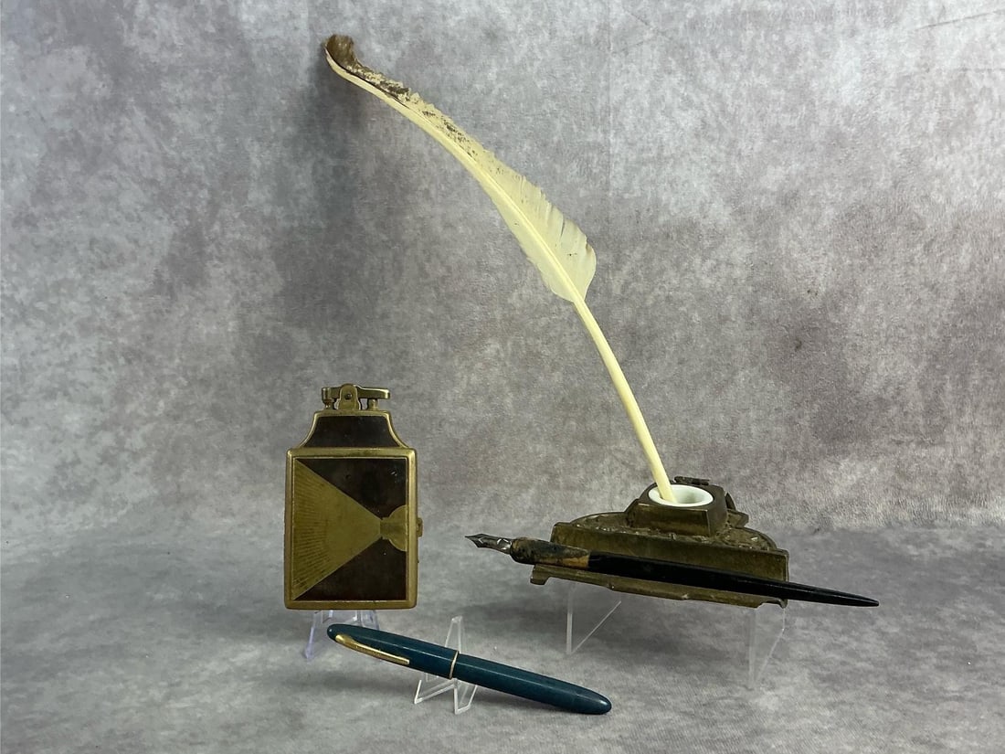 14kt Tipped Fountain Pen & More: Schaffer's 14kt gold tipped fountain pen, Ronson art deco lighter and cigarette case combo, brass ink well, and more. All in good condition. Case measures 2.5 inches wide x 4.25 inches tall.