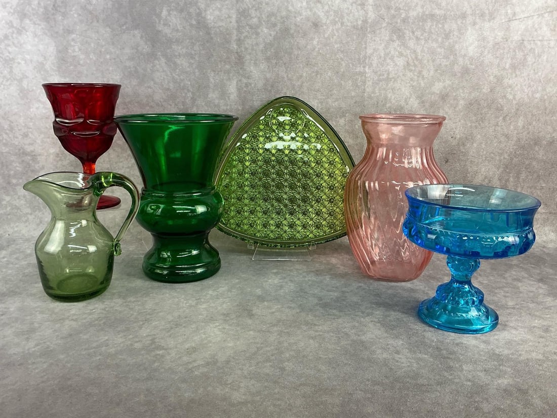 MCM Colored Glass Finds: MCM colored glass finds including a hand blown glass pitcher from Jamestown Glasshouse in Virginia, green glass snack plate, blue Indiana glass compost, and more. All in good condition. Largest vase
