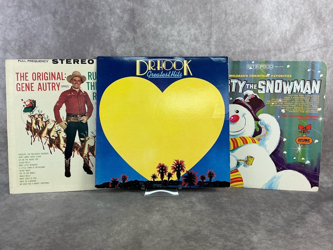 Vinyls: 1980 Dr. Hook Greatest Hits, Gene Autry Christmas favorites, and Frosty the Snowman. All in good condition with some sleeve issues to cardboard at seams. Each measures 12.25 inches wide x 12.25