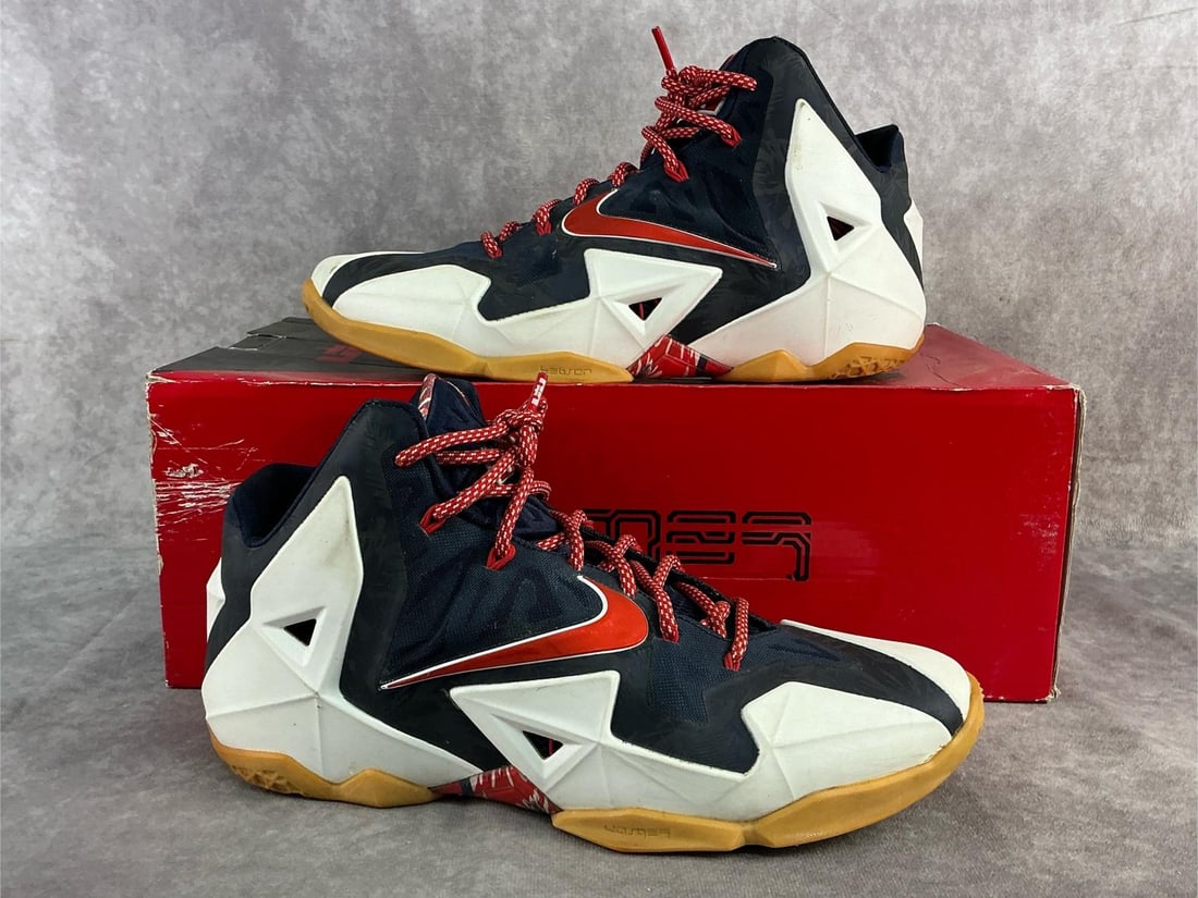 Nike Lebron 11: Men's 2014 Nike LeBron 11 ‘Independence Day' sneakers, featuring a white and navy design with red accents. In good used condition and comes with original box. US size 10.5.