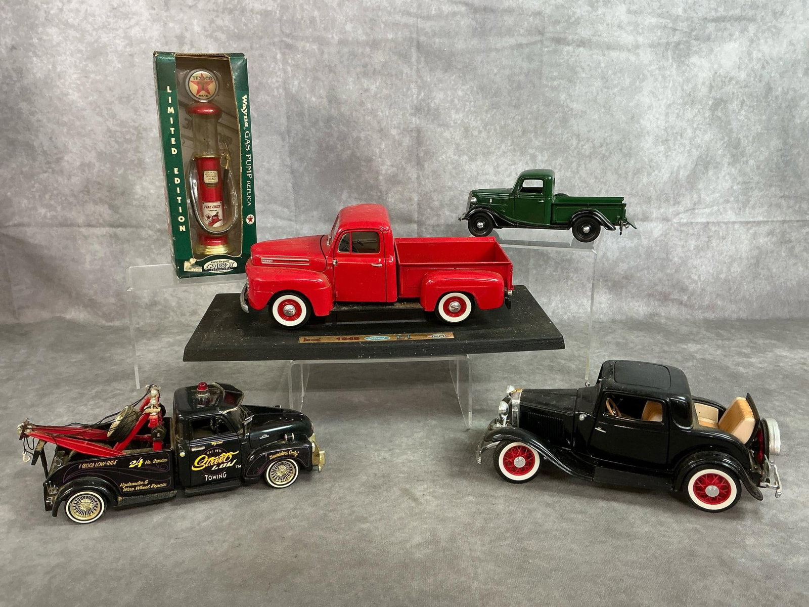 Diecast Collectors Trucks & More: Five antique collectors replicas. Includes a 1948 Ford F-1 Pick-Up Truck, 1937 Ford Pickup 1:24 scale, 1953 Jada Chevrolet Lowrider Tow truck 1:24 scale, 1932 Ford 3 window Coupe 1:16 scale and a Limi
