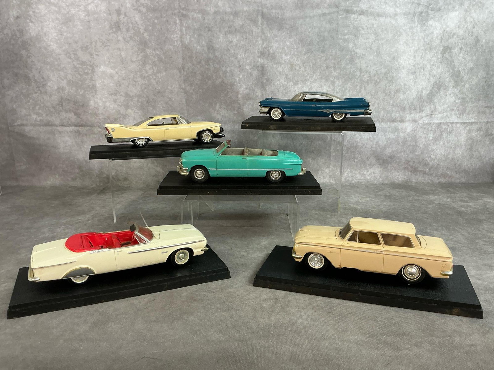Collectors Model Cars: Five antique classic car replicas. Collection includes a 1950 Ford Custom convertible, 1960 Plymouth Fury, 1962 Plymouth Fury Convertible, 1960 Dodge Polara Hardtop and a 1962 AMC Rambler. All cars ha
