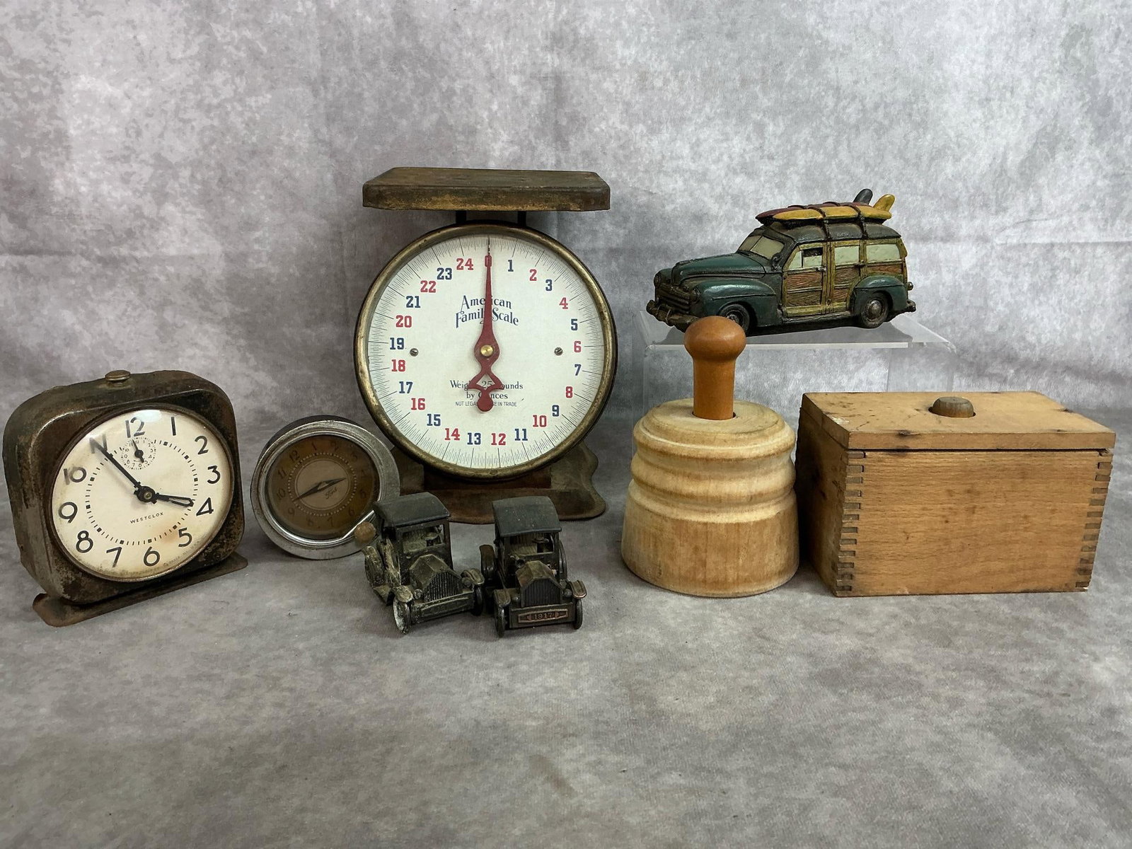 Vintage Scales, Ford Clock, Butter Molds, & More: Eight early to mid 1900's collectibles. Includes American Family Scale, Westclox alarm clock, and 1937 Ford auto glove box clock. Also two wooden butter molds, two model T's pencil sharpeners, and Pop