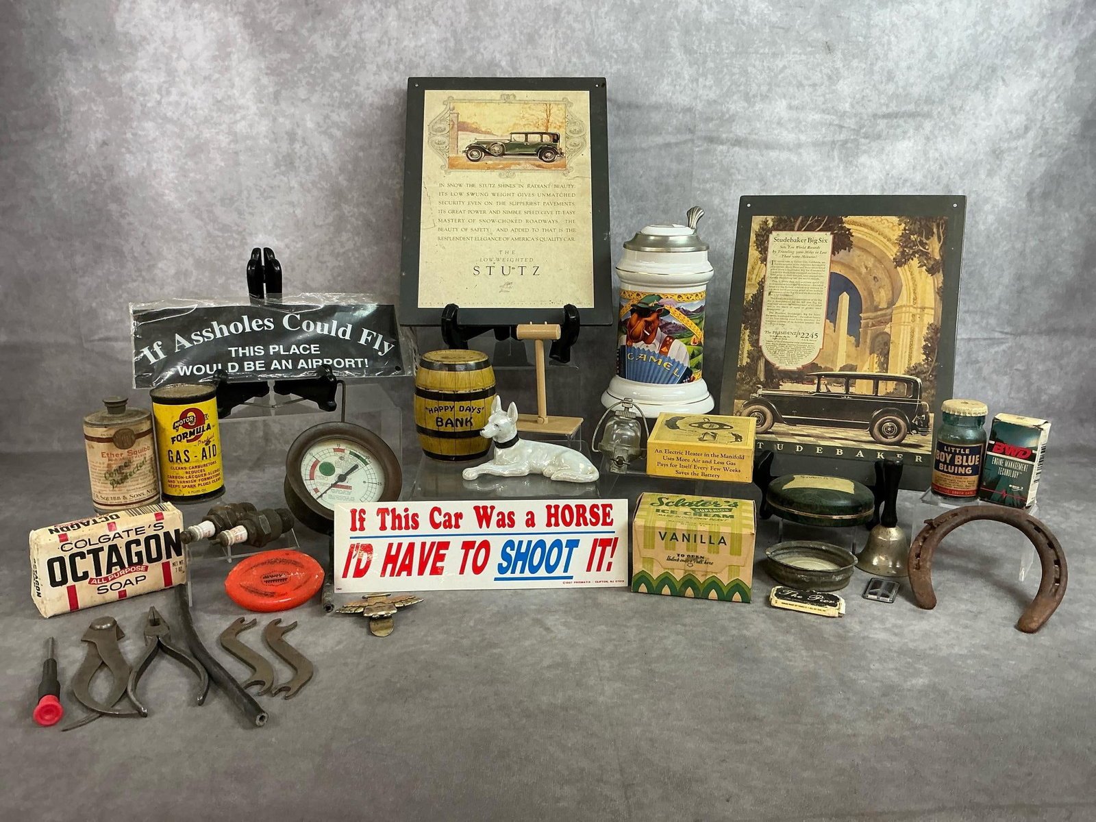 Vintage Advertising Treasures & More: Thirty two vintage advertising items including Camels beer stein, Ford accents and more. All in fair to good condition.