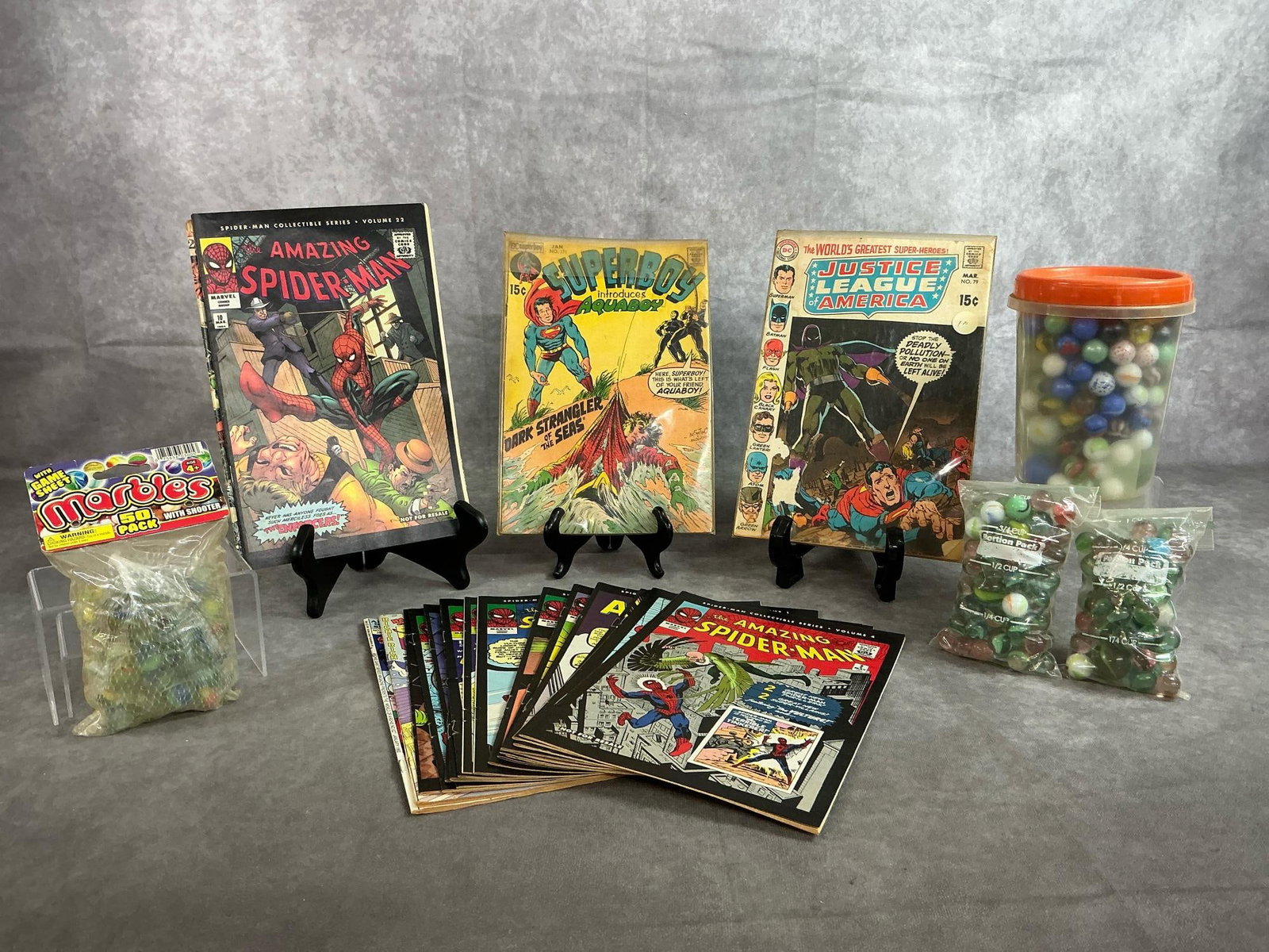 Comic Books & Marbles: All in good condition. Comic books measure 6.5 inches wide x 10.25 inches tall.