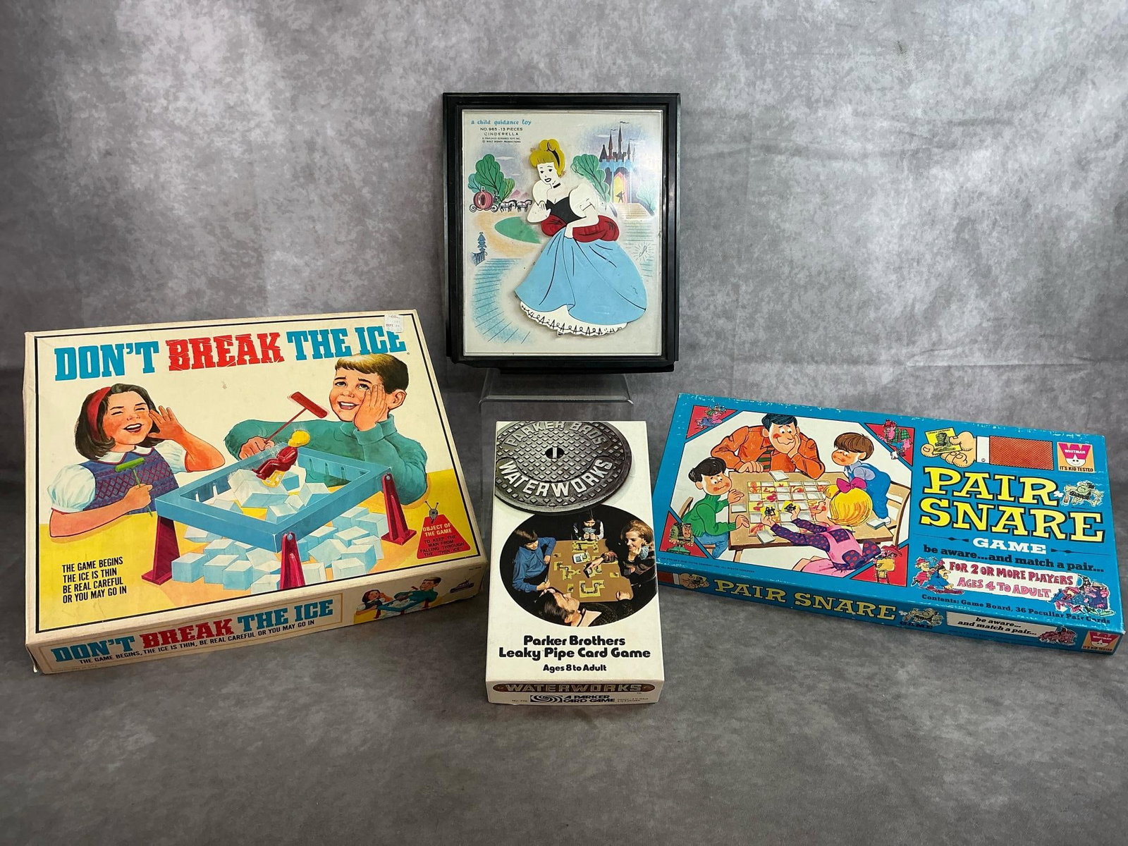 Games & Cinderella Puzzle: Contents not verified. All in fair to good condition. Don't Break the Ice Game measures 13.75 inches long x 11.5 x 2.5 inches tall.