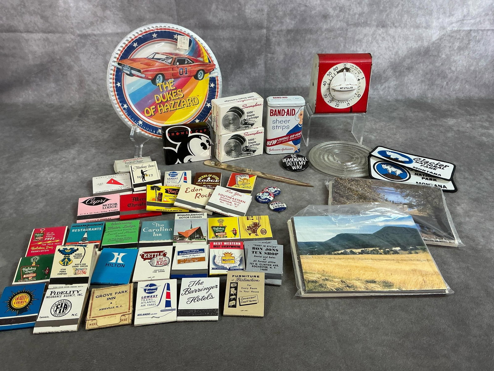 Vintage Matches, Cards, Band-aids, & More: Thirty-five matchbooks, and fifteen vintage items. Includes collectible matchbooks from motels, restaurants, and more. Dukes of Hazzard cake plates, Glacier National Park patches, two packs of 8 notec