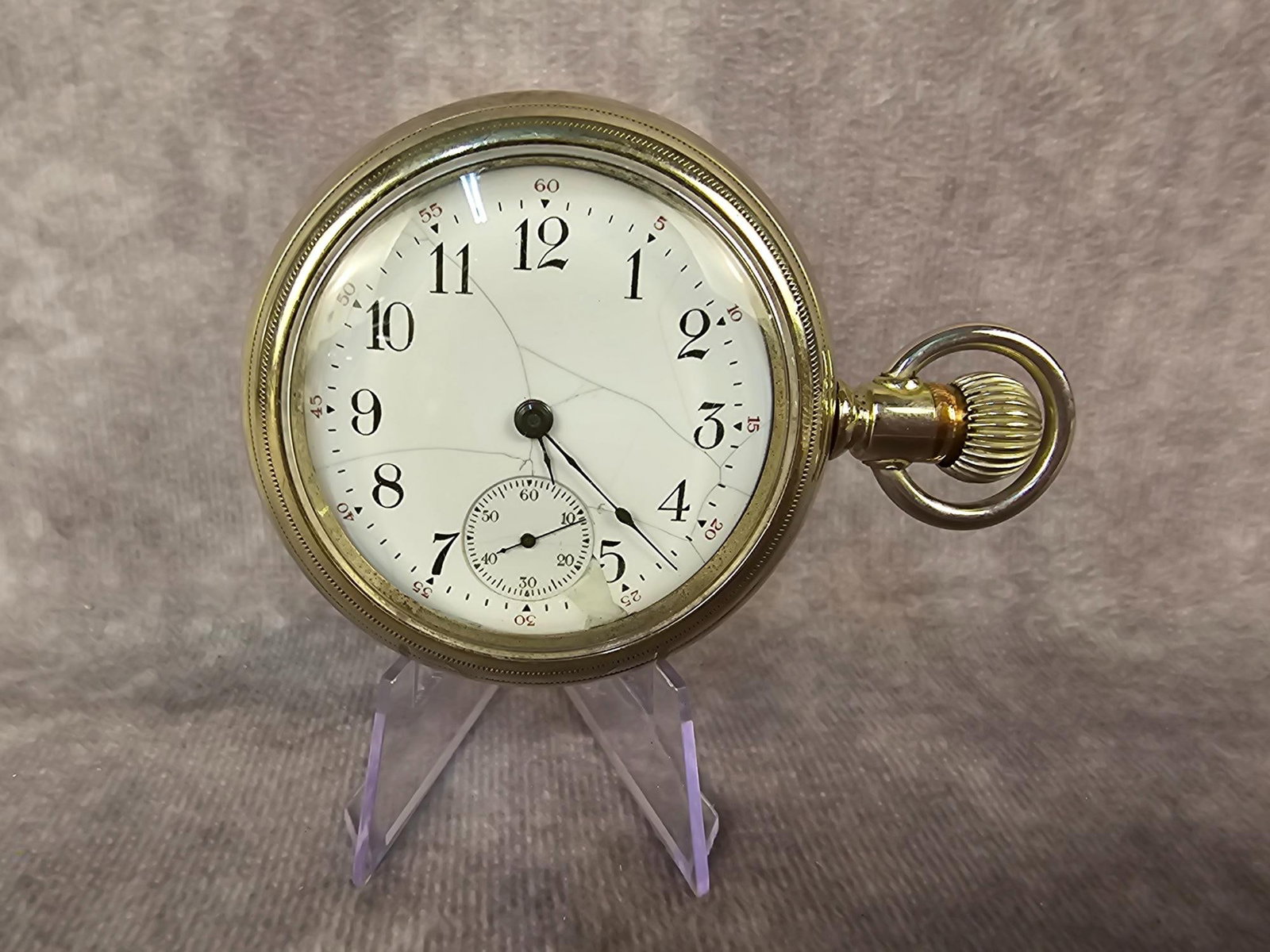South Bend Pocket Watch: Circa 1906 South Bend Watch Co pocket watch in a swing-out case. Currently running. Crack and chip to porcain dial. Measures 2.25 inches in diameter.