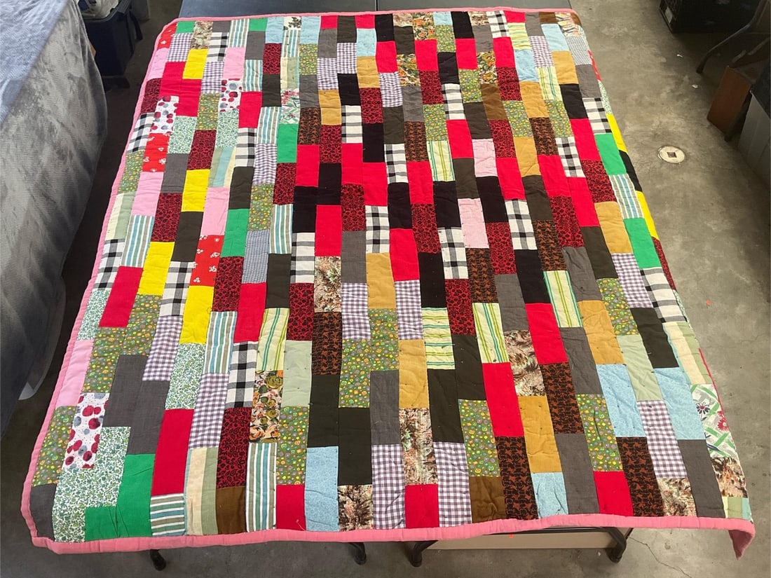 Homemade Quilt: Vintage homemade quilt, machine stitched and hand quilted. Good condition. Measures 69 inches wide x 79 inches long.