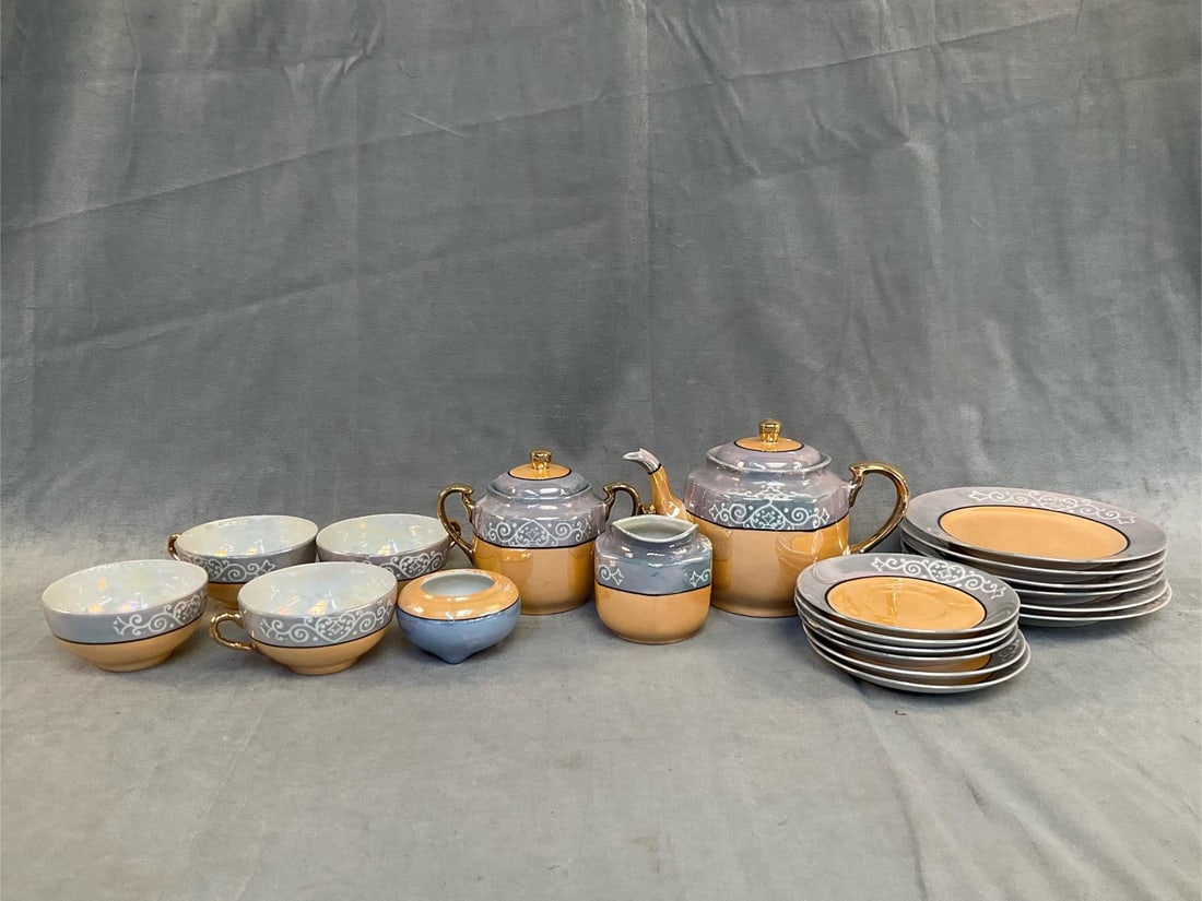 Tea Set/Japan: Circa 1930 twenty piece Takito Co. TT Japanese lustreware peach pearl iridescent Tea Service. Consisting of; six plates, six saucers, creamer, sugar, teapot, bowl and four cups. Good condition. Plate 