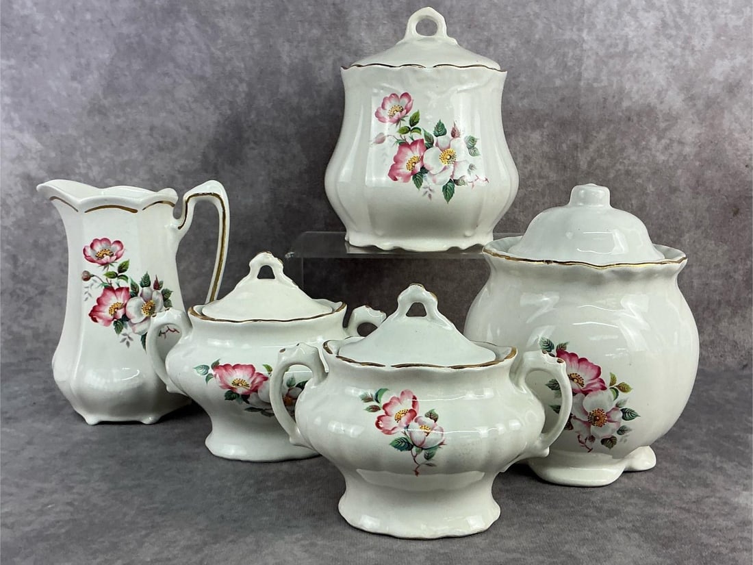 House of Webster: 1970s House of Webster ceramics. Five pieces of Briar Rose pattern from Eastland, Texas. All in good condition. Largest canister measures 3.5 inches wide x 6.75 inches tall.
