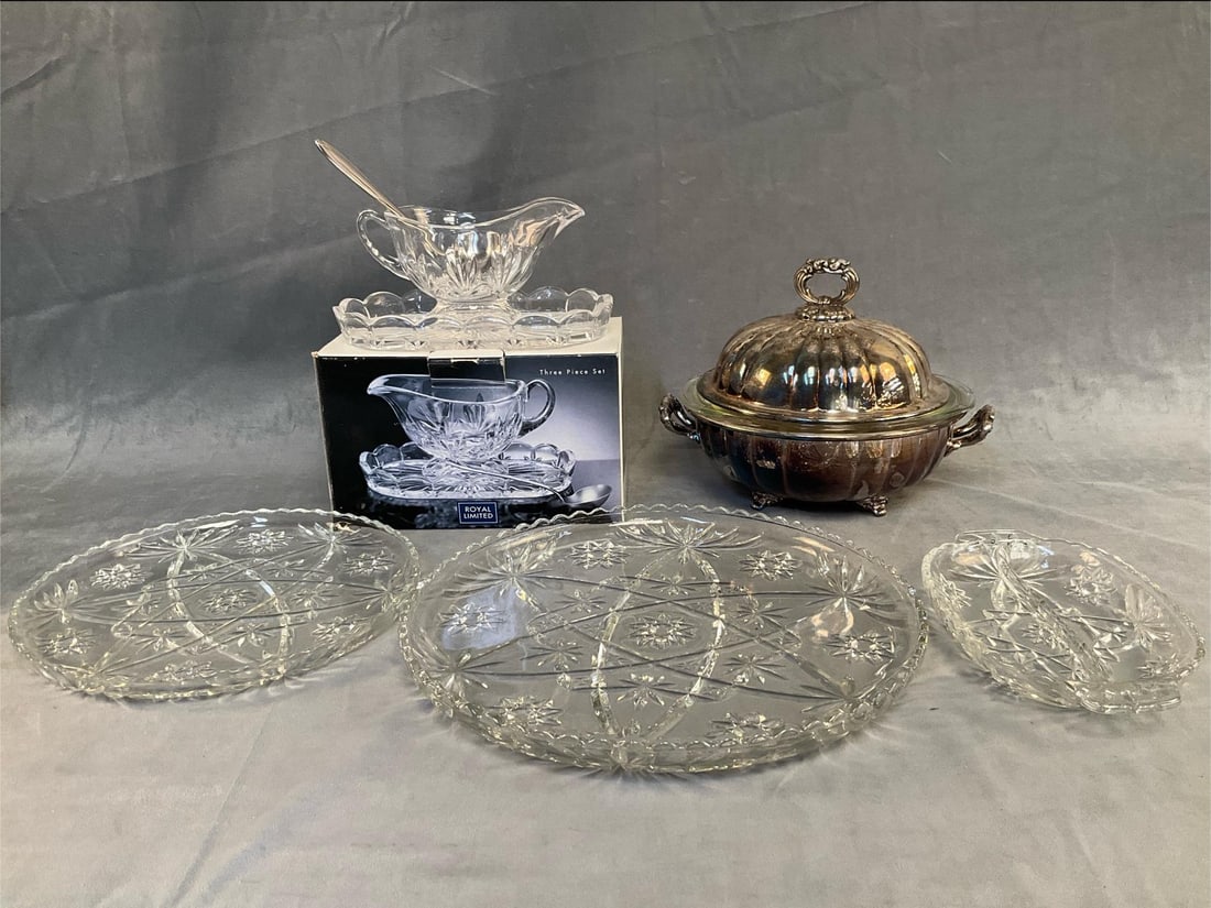 China and Silverplate: Nine contemporary pieces including; two crystal platters, crystal divided relish dish, Poole cover silverlated bowl (crack at rim) with removable Pyrex liner with chip to rim. Three piece Royal Limite
